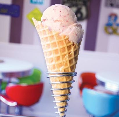 Freshly scooped strawberry ice cream cone at Rocky RD Ice Cream Co.